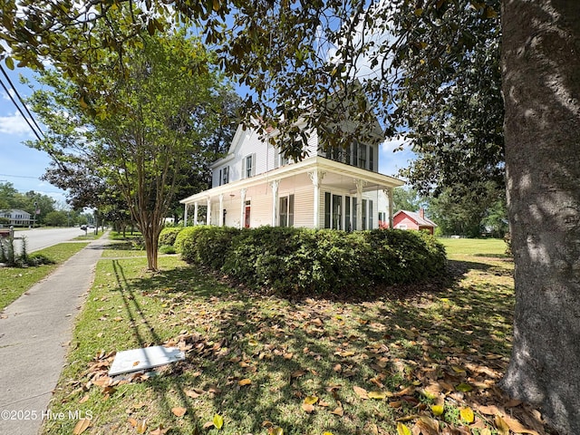 view of property exterior featuring a lawn