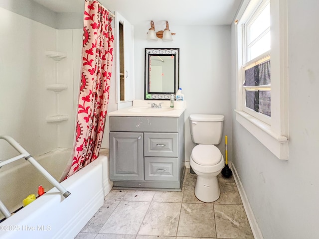 bathroom featuring toilet, baseboards, shower / tub combo, and vanity
