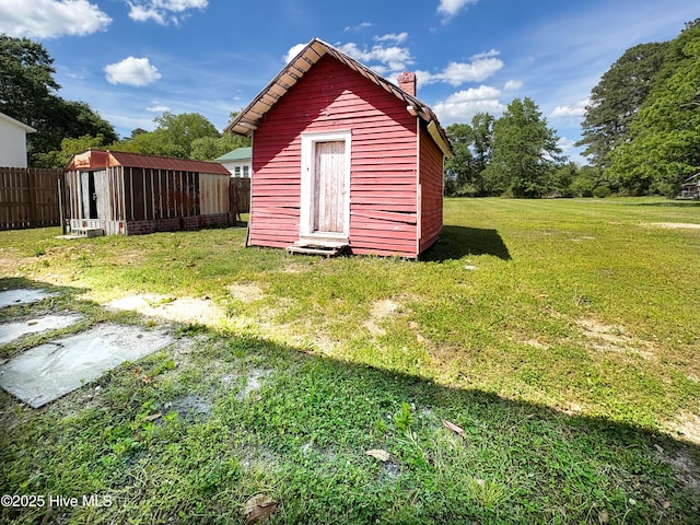 view of shed with fence