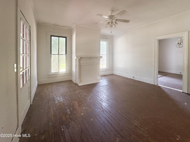 311 W Jones St, Trenton, NC 28585 - unfurnished living room featuring crown molding, hardwood / wood-style floors, a ceiling fan, and baseboards