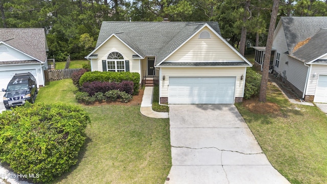 4109 Kettering Pl, Wilmington, NC 28412 - traditional-style home featuring concrete driveway, an attached garage, and roof with shingles