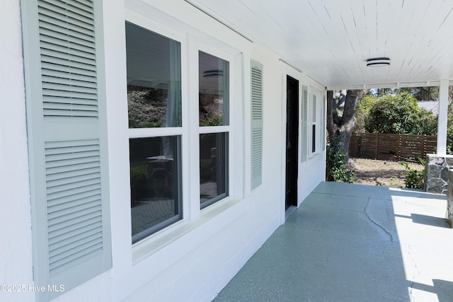 view of patio featuring fence