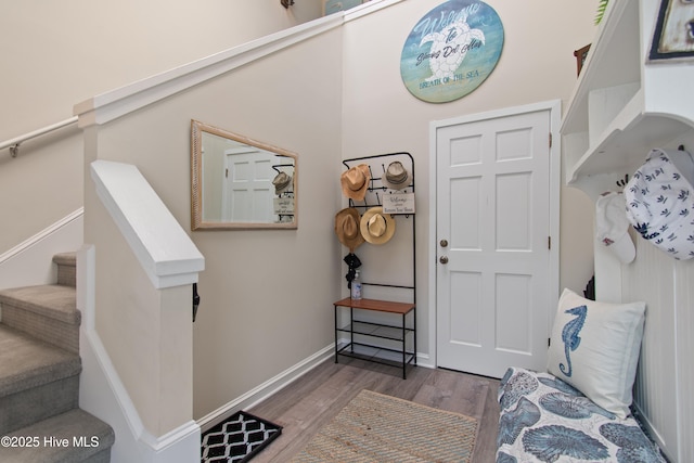 1710 Deerfield Ct SW Unit 4A, Ocean Isle Beach, NC 28469 - foyer featuring wood finished floors, stairs, and baseboards