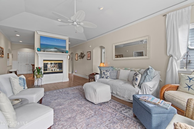 1710 Deerfield Ct SW Unit 4A, Ocean Isle Beach, NC 28469 - living room with arched walkways, crown molding, lofted ceiling, wood finished floors, and a ceiling fan