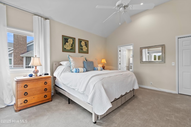 1710 Deerfield Ct SW Unit 4A, Ocean Isle Beach, NC 28469 - bedroom with light colored carpet, a ceiling fan, baseboards, high vaulted ceiling, and connected bathroom
