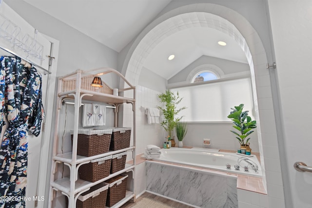 1710 Deerfield Ct SW Unit 4A, Ocean Isle Beach, NC 28469 - bathroom featuring lofted ceiling, a garden tub, and recessed lighting