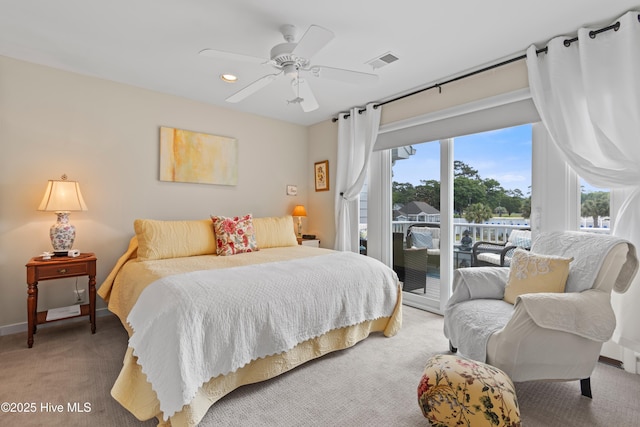 1710 Deerfield Ct SW Unit 4A, Ocean Isle Beach, NC 28469 - bedroom featuring access to outside, light colored carpet, ceiling fan, and baseboards
