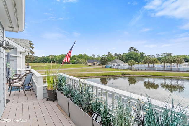 1710 Deerfield Ct SW Unit 4A, Ocean Isle Beach, NC 28469 - wooden terrace featuring a water view