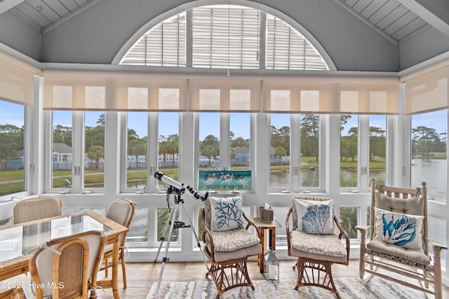 1710 Deerfield Ct SW Unit 4A, Ocean Isle Beach, NC 28469 - sunroom with lofted ceiling, wood finished floors, a water view, and wood ceiling