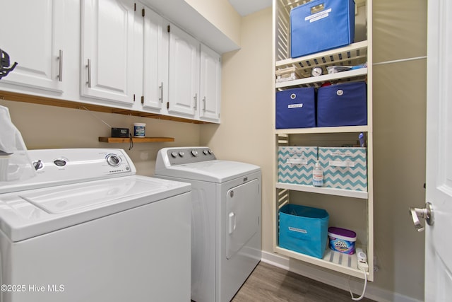 1710 Deerfield Ct SW Unit 4A, Ocean Isle Beach, NC 28469 - laundry room featuring washing machine and dryer, cabinet space, wood finished floors, and baseboards