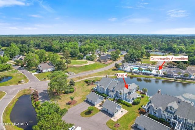 1710 Deerfield Ct SW Unit 4A, Ocean Isle Beach, NC 28469 - aerial view of residential area featuring a nearby body of water and a heavily wooded area