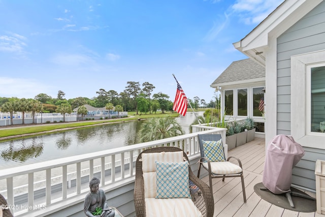 1710 Deerfield Ct SW Unit 4A, Ocean Isle Beach, NC 28469 - wooden deck featuring a water view