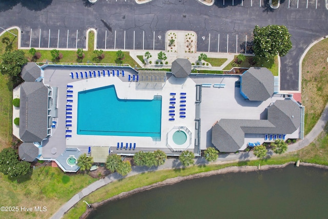 1710 Deerfield Ct SW Unit 4A, Ocean Isle Beach, NC 28469 - drone / aerial view of a pool and a nearby body of water