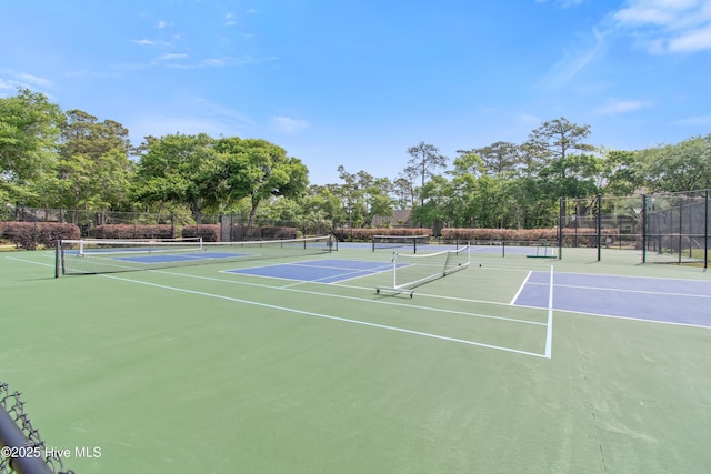 1710 Deerfield Ct SW Unit 4A, Ocean Isle Beach, NC 28469 - view of tennis court with community basketball court