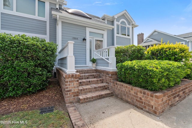 1710 Deerfield Ct SW Unit 4A, Ocean Isle Beach, NC 28469 - entrance to property featuring roof with shingles