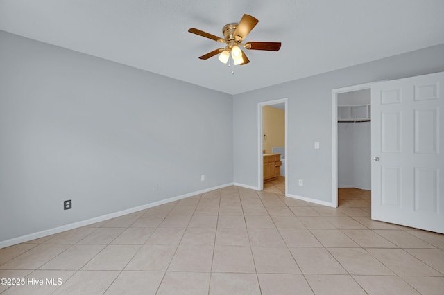2910 Mulberry Ln Unit B, Greenville, NC 27858 - unfurnished bedroom with a spacious closet, a closet, light tile patterned floors, ensuite bath, and a ceiling fan