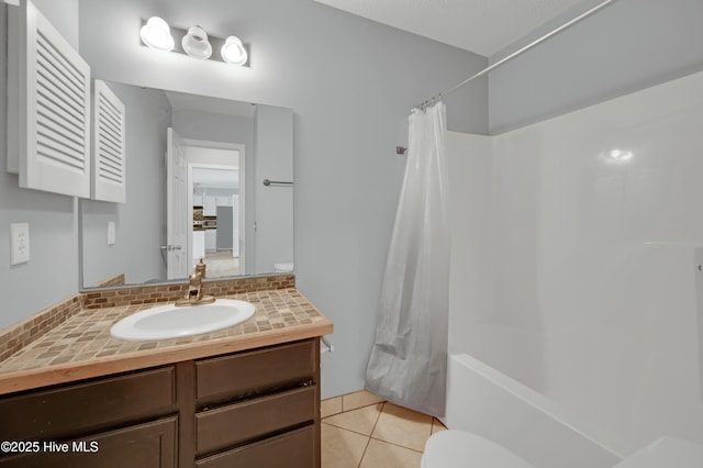 2910 Mulberry Ln Unit B, Greenville, NC 27858 - full bath featuring vanity, shower / tub combo with curtain, tile patterned floors, and decorative backsplash