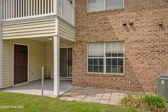 2910 Mulberry Ln Unit B, Greenville, NC 27858 - doorway to property featuring a balcony, a patio area, and brick siding