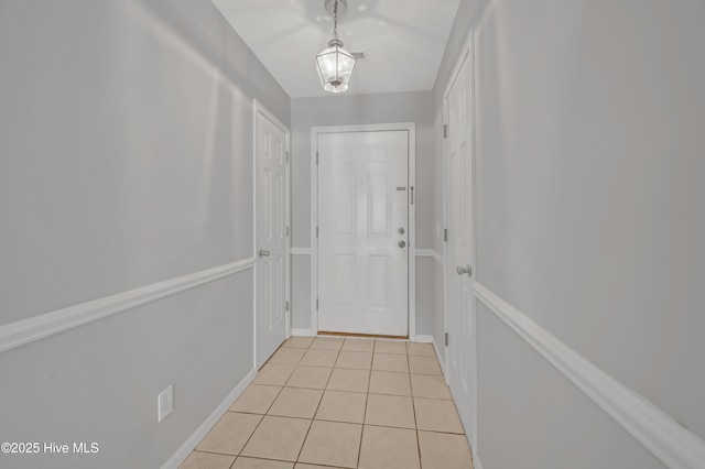 2910 Mulberry Ln Unit B, Greenville, NC 27858 - doorway to outside featuring light tile patterned floors and baseboards