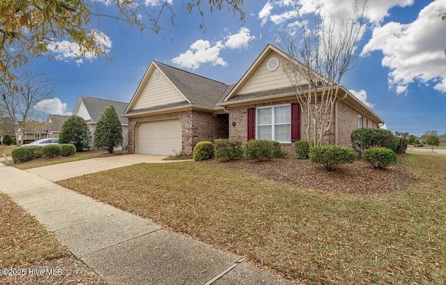 single story home featuring brick siding, a garage, a front lawn, and concrete driveway