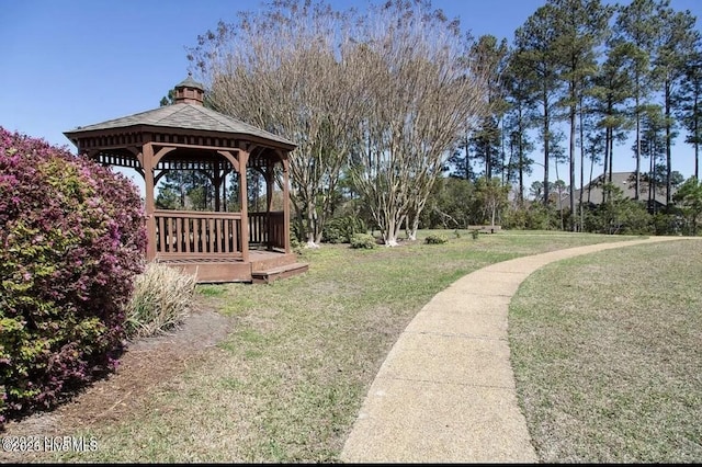 surrounding community featuring a lawn and a gazebo