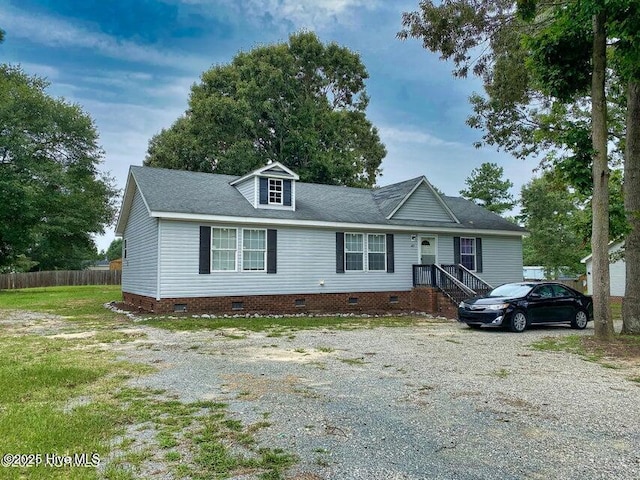 ranch-style house featuring crawl space and fence