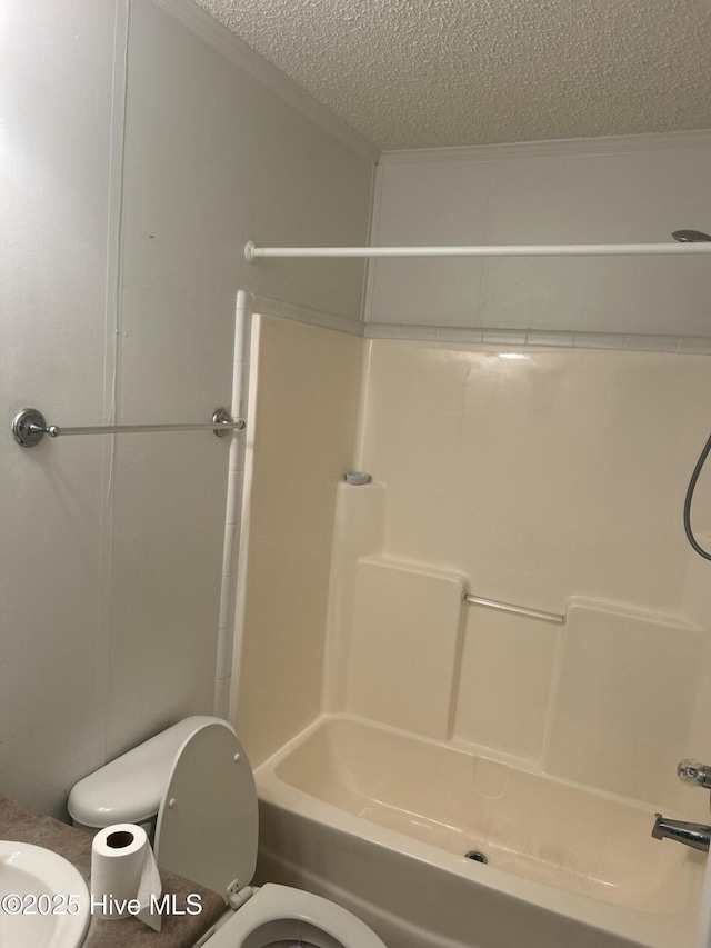 full bath with toilet, a textured ceiling, and shower / tub combination