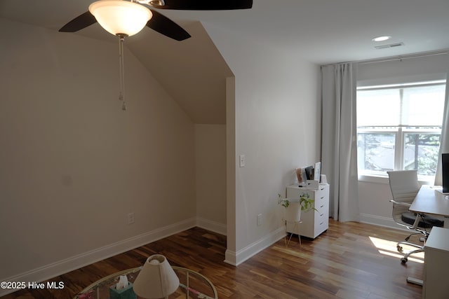 unfurnished office with baseboards, ceiling fan, and wood finished floors