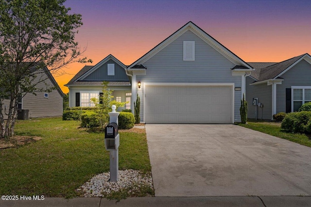 view of front of home with a garage, board and batten siding, concrete driveway, and a front lawn