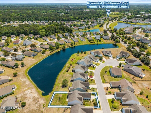 bird's eye view featuring a residential view and a water view