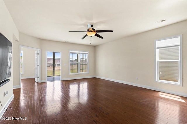 empty room featuring a ceiling fan, baseboards, and visible vents
