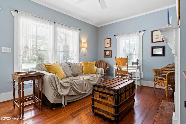 312 E W St, Southport, NC 28461 - living room featuring ornamental molding, hardwood / wood-style floors, a ceiling fan, and baseboards