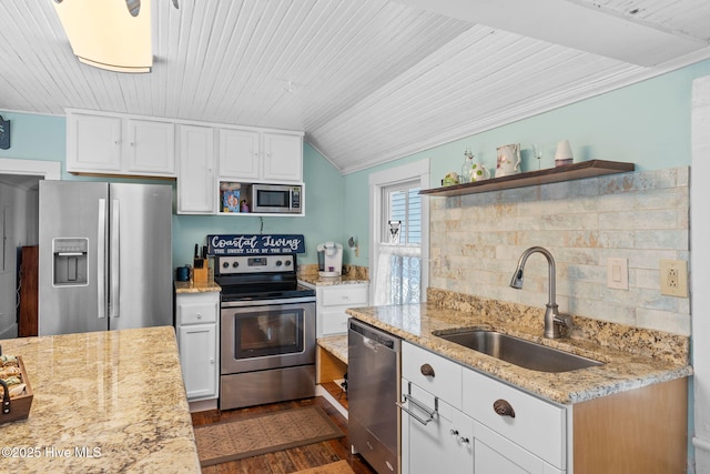 312 E W St, Southport, NC 28461 - kitchen with appliances with stainless steel finishes, open shelves, a sink, dark wood-type flooring, and white cabinets