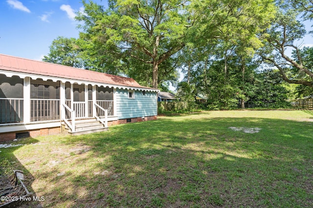 312 E W St, Southport, NC 28461 - view of yard featuring a sunroom
