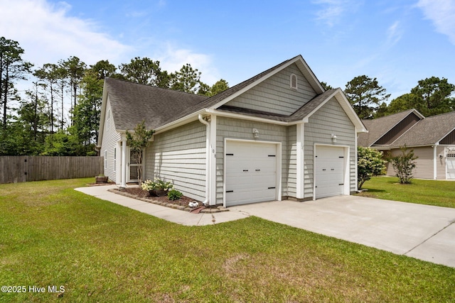 view of front of home featuring a garage, driveway, and a shingled roof