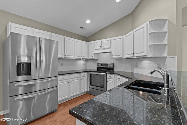 kitchen featuring visible vents, open shelves, under cabinet range hood, a sink, and appliances with stainless steel finishes