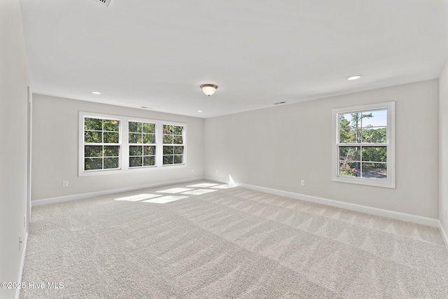 231 Dona Dr, Carthage, NC 28327 - empty room with light colored carpet, baseboards, plenty of natural light, and recessed lighting
