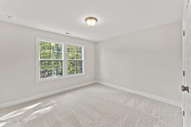 231 Dona Dr, Carthage, NC 28327 - carpeted spare room with baseboards and a smoke detector