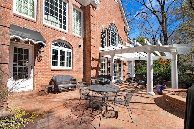 view of patio / terrace featuring a pergola and outdoor dining space