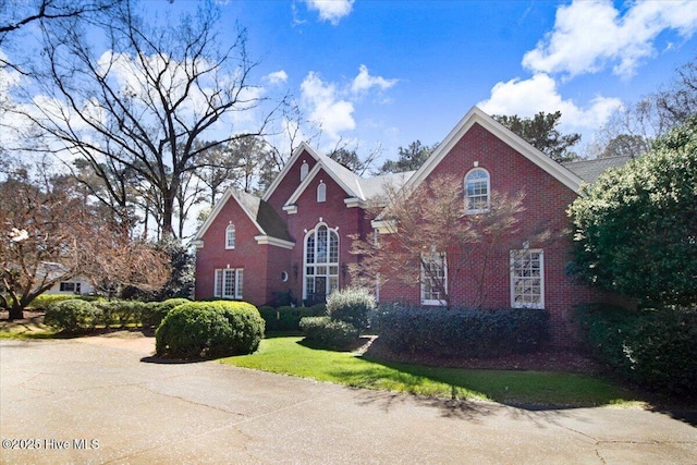 view of front of house featuring brick siding