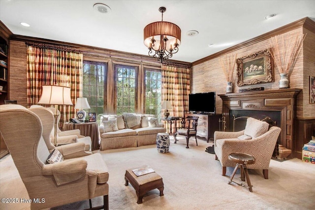 living room with ornamental molding, carpet, and a notable chandelier