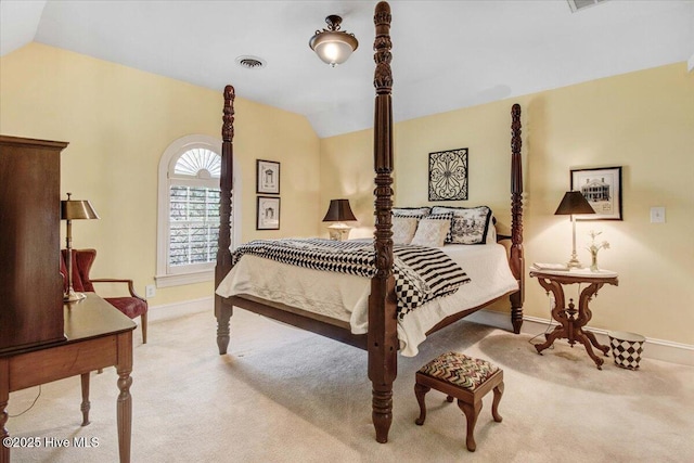 bedroom with carpet floors, baseboards, vaulted ceiling, and visible vents