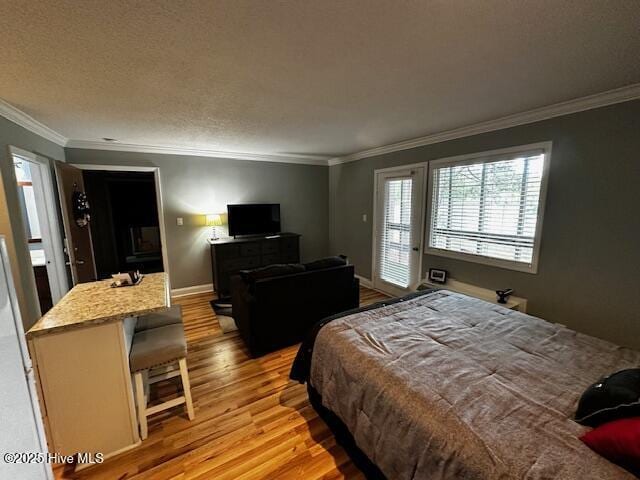 6214 Harbourside Dr, New Bern, NC 28560 - bedroom with crown molding, light wood-style flooring, and baseboards
