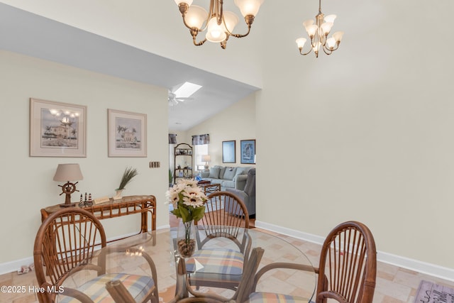 dining space with baseboards and a chandelier