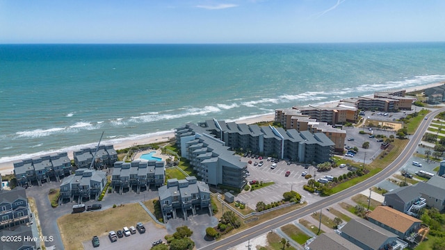 aerial view featuring a view of the beach and a water view