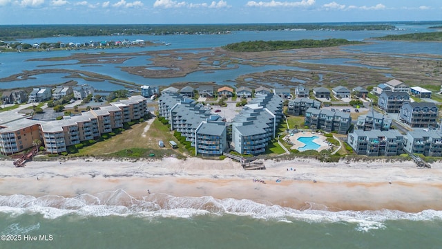drone / aerial view with a water view and a view of the beach