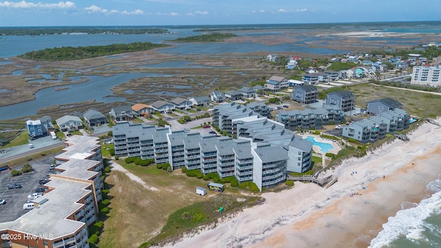 bird's eye view with a beach view and a water view