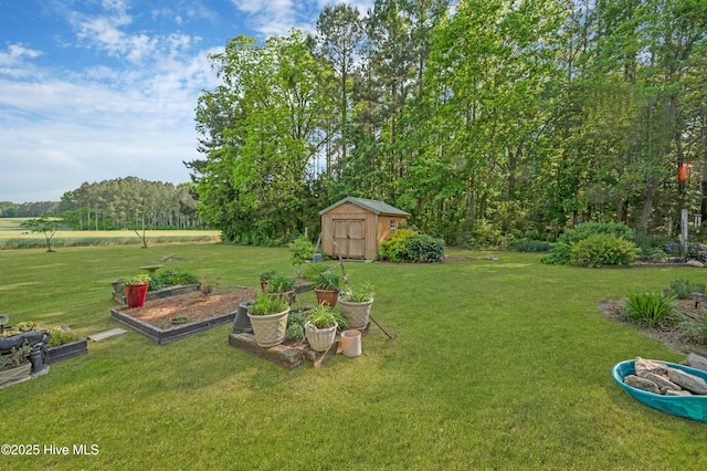 view of yard featuring a storage unit and an outdoor structure