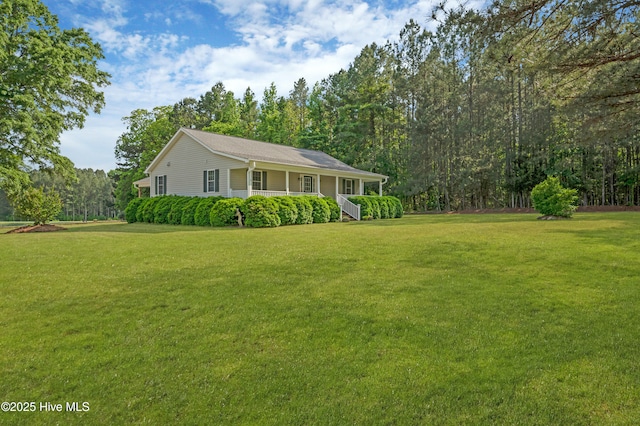 exterior space featuring covered porch and a front lawn