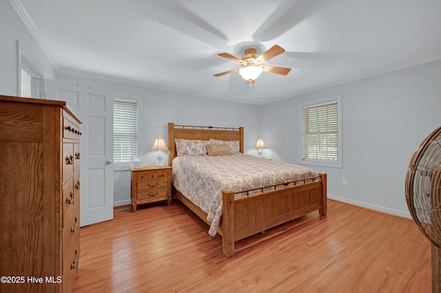 bedroom featuring crown molding, baseboards, and light wood-type flooring